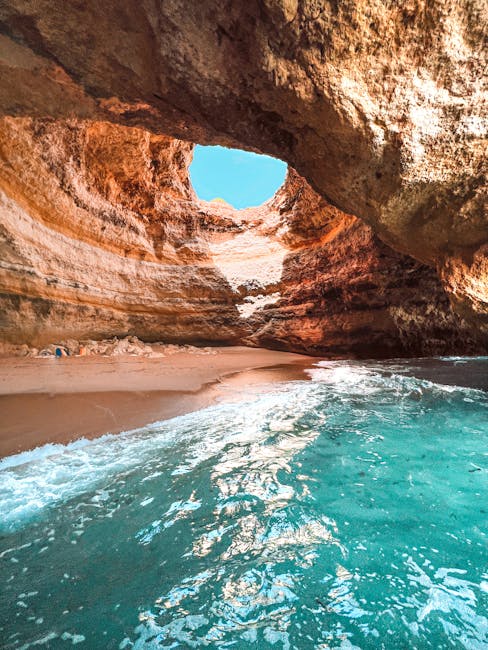 Speedboat touring along the Algarve coast near cave formations