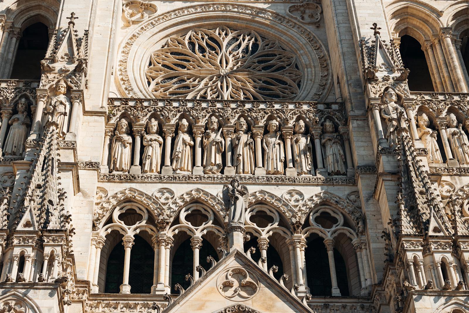 Gothic cathedral ornate sculptures and rose window in Amiens France