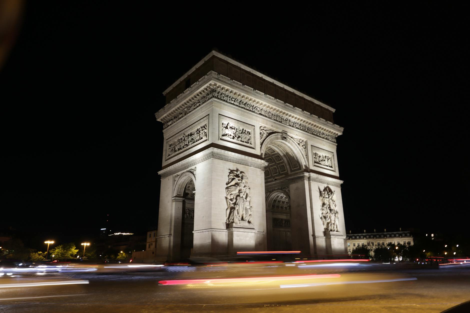 The Arc de Triomphe beautifully lit at night in Paris