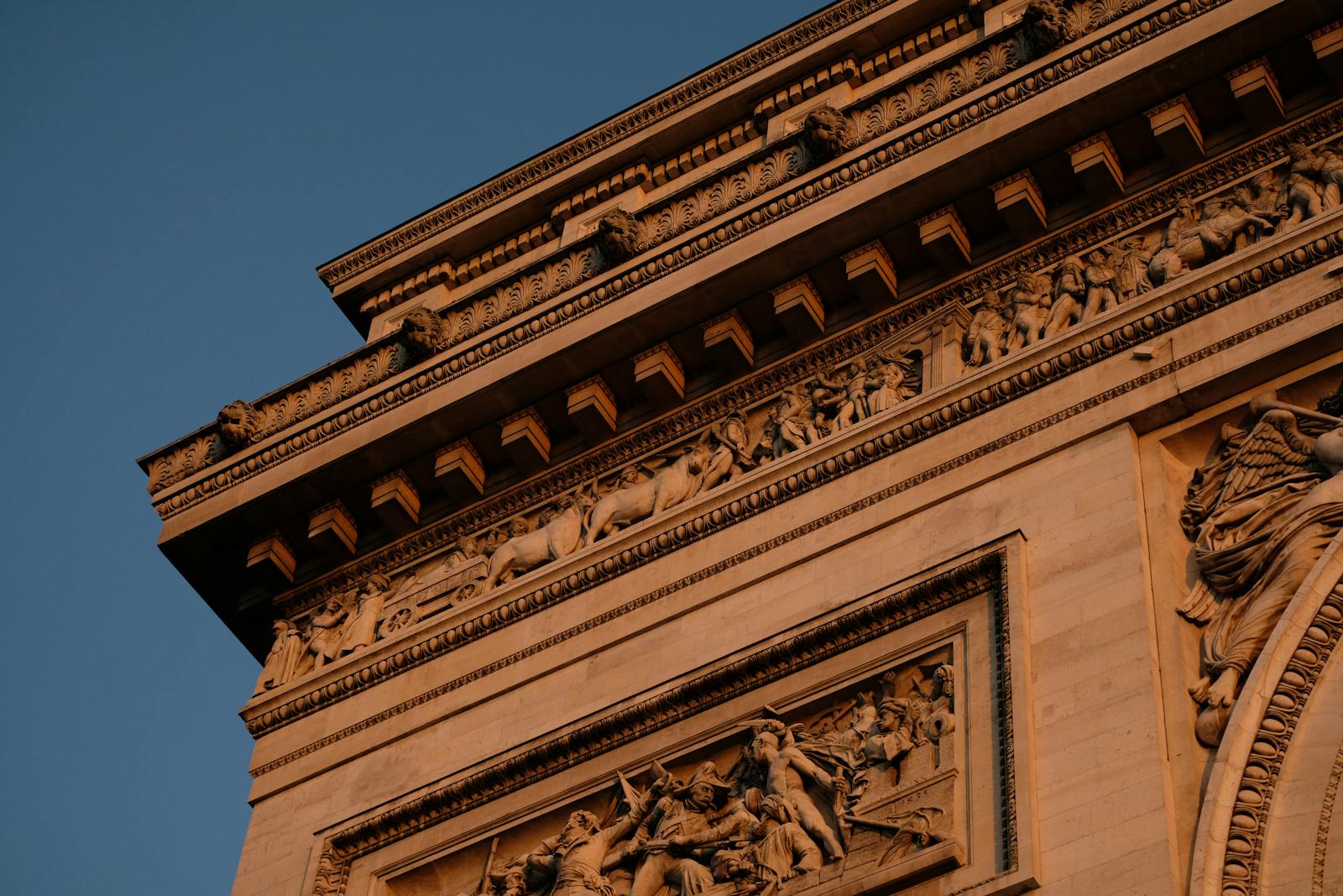 Detailed view of the ornate carvings on the Arc de Triomphe in Paris