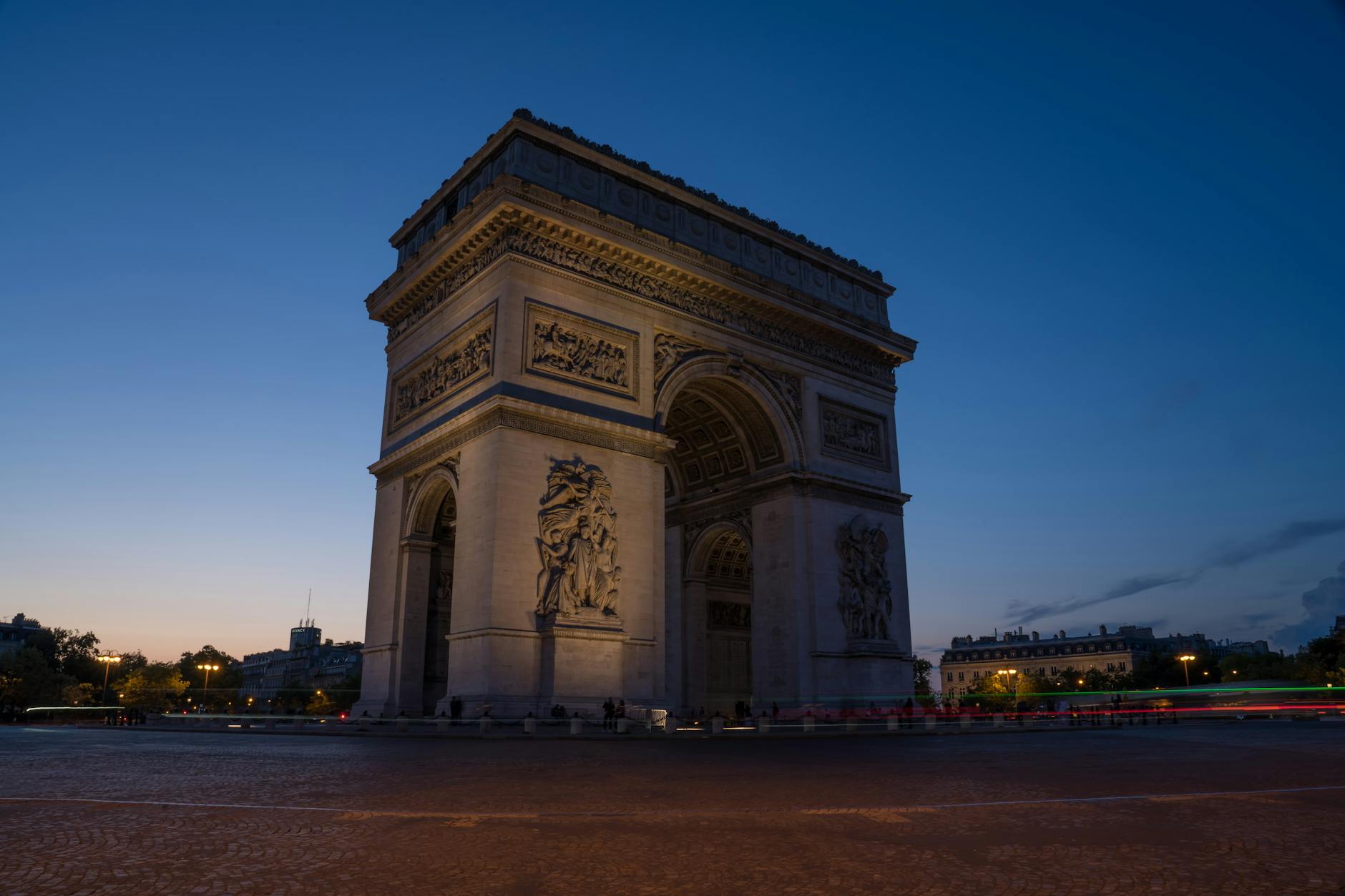 A captivating twilight shot of the Arc de Triomphe with a dramatic sky