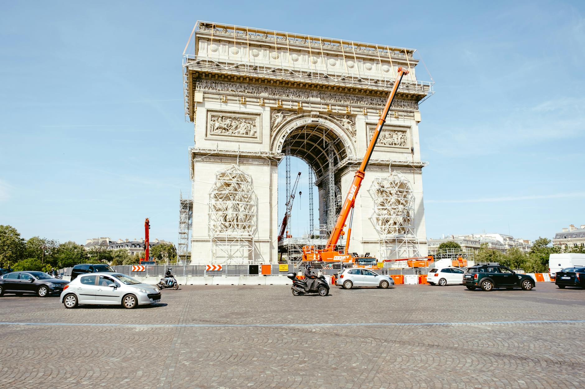The Arc de Triomphe under construction with scaffolding