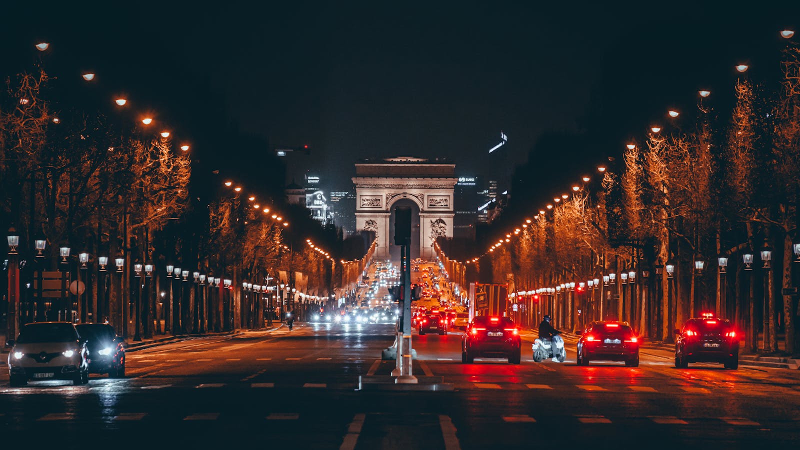 Arc de Triomphe at night on the illuminated Champs-Elysees in Paris