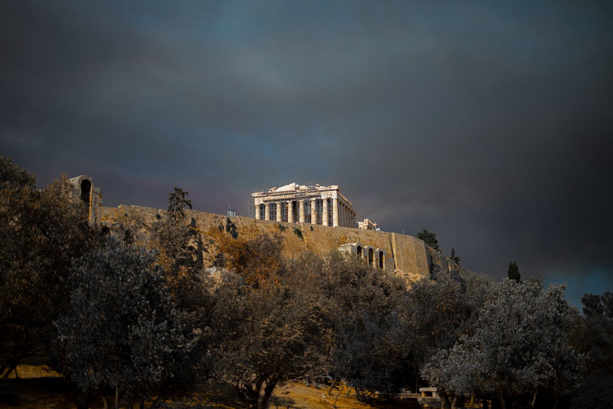 Wide panoramic view of the Acropolis of Athens under dramatic sky