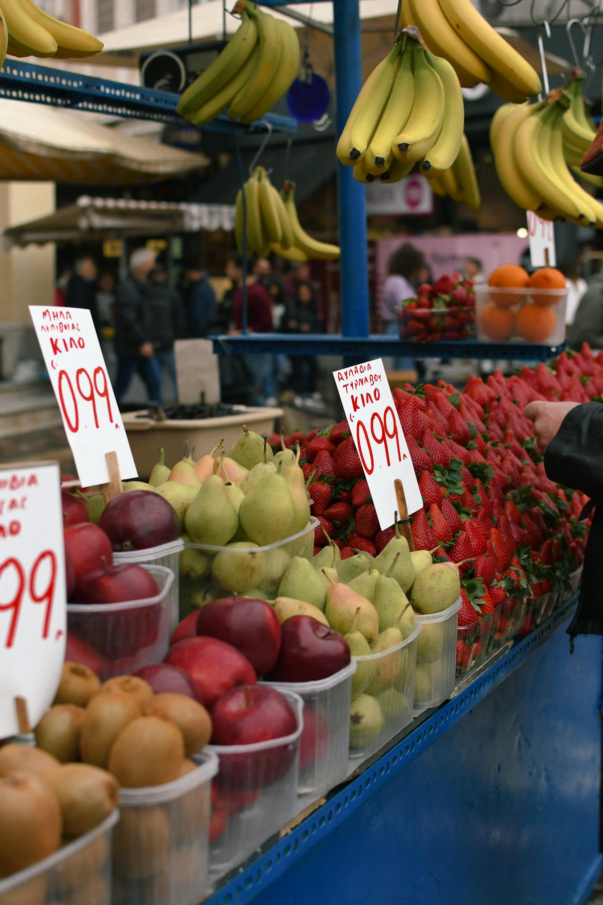 Colourful display of fruits at a market stall in Athens