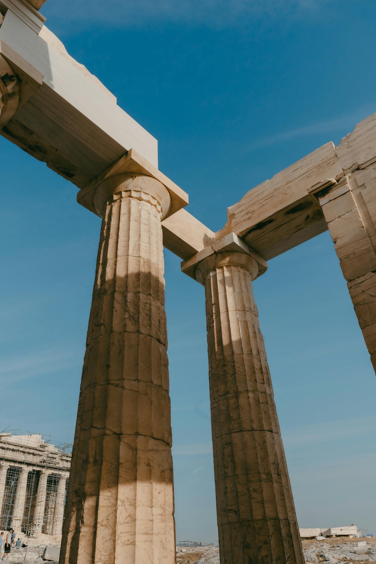 Close-up of the Doric columns of the Parthenon under blue sky