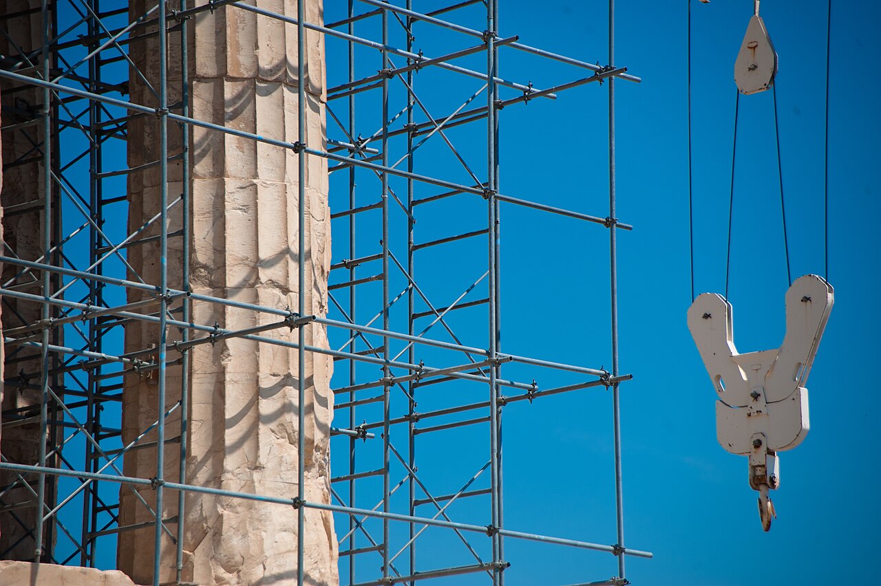Reconstruction works on the Parthenon at the Athenian Acropolis with Athens cityscape