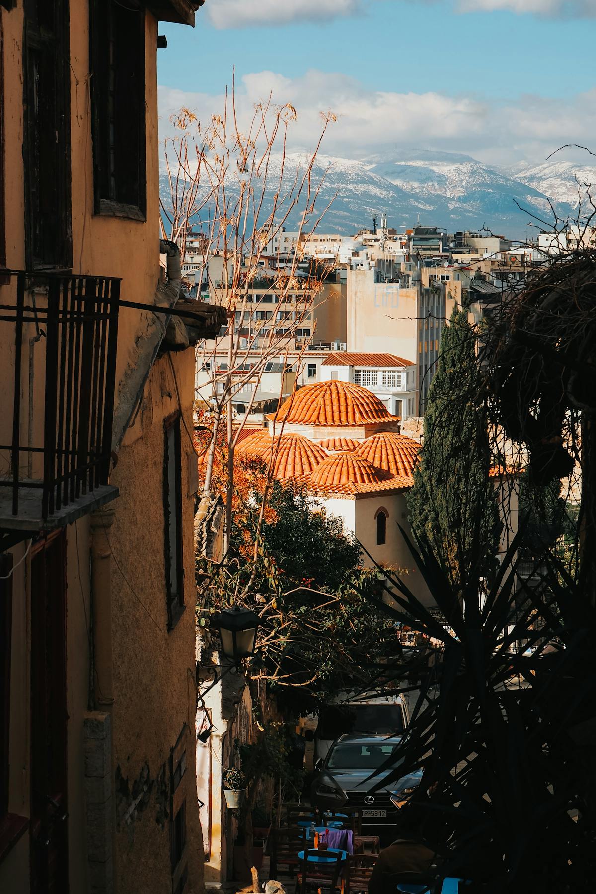 Picturesque Athens rooftops with mountain backdrop