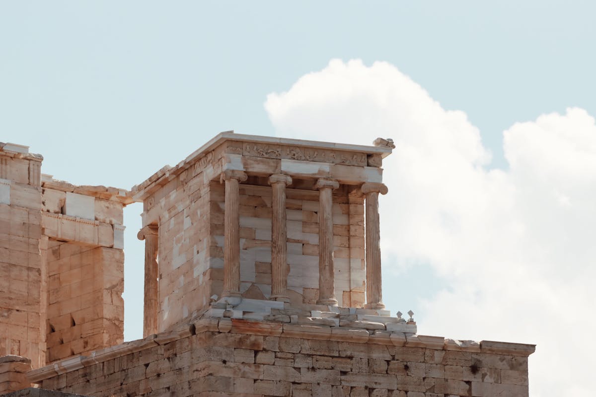 Close-up of ancient temple ruins at the Acropolis under clear sky