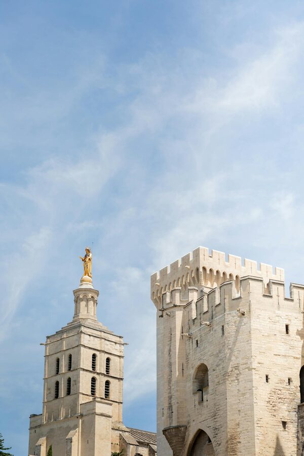 Historic architecture of Avignon against clear blue sky in Provence