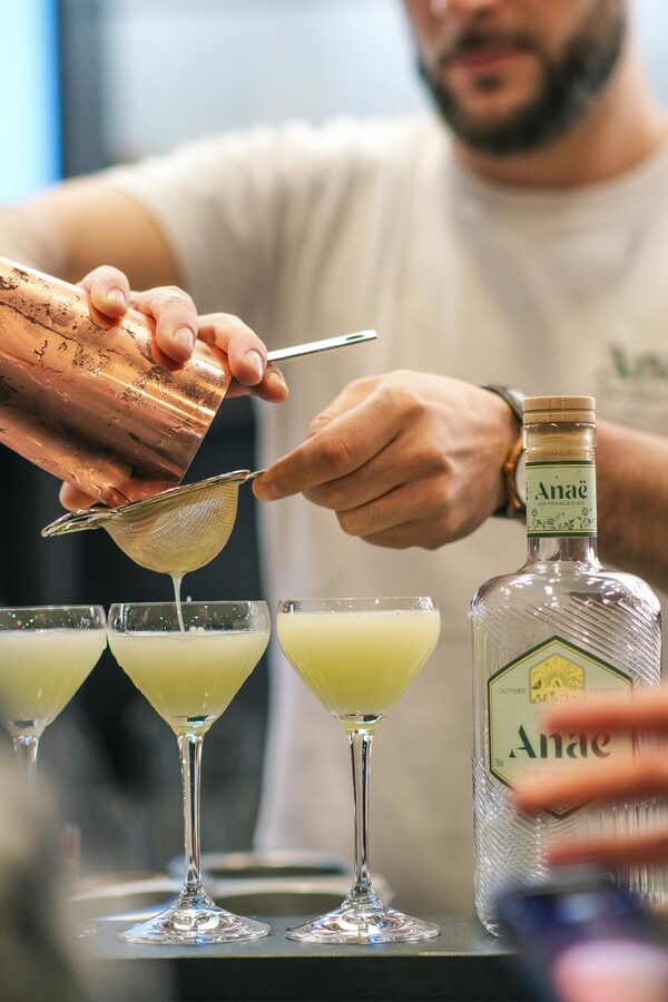 Bartender pouring cocktails in a Parisian bar