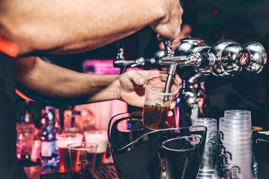 Bartender pouring beer at Berlin bar