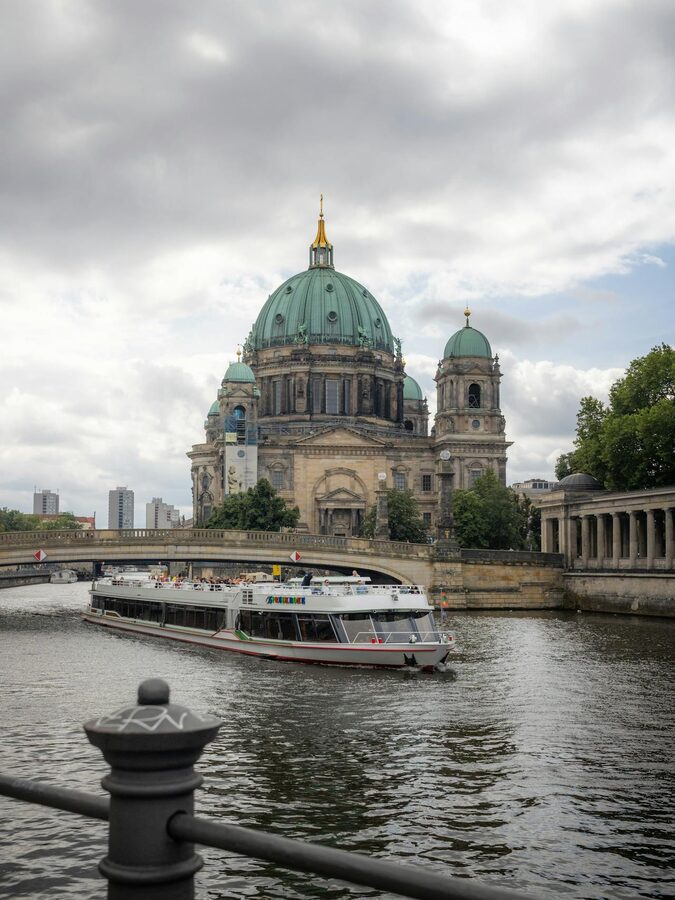 Berlin Cathedral along the River Spree with tourist boat