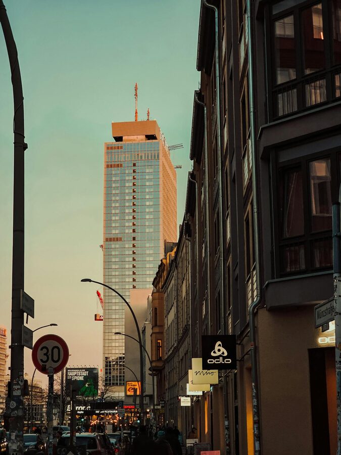 Berlin street with modern and historic buildings at dusk