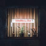 Cozy Berlin pub window with illuminated sign