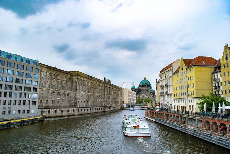 Berlin riverfront with historic architecture and boat