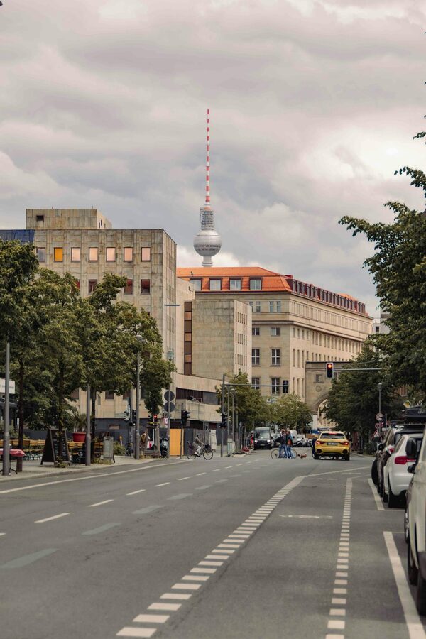 Berlin street with TV tower on a cloudy day