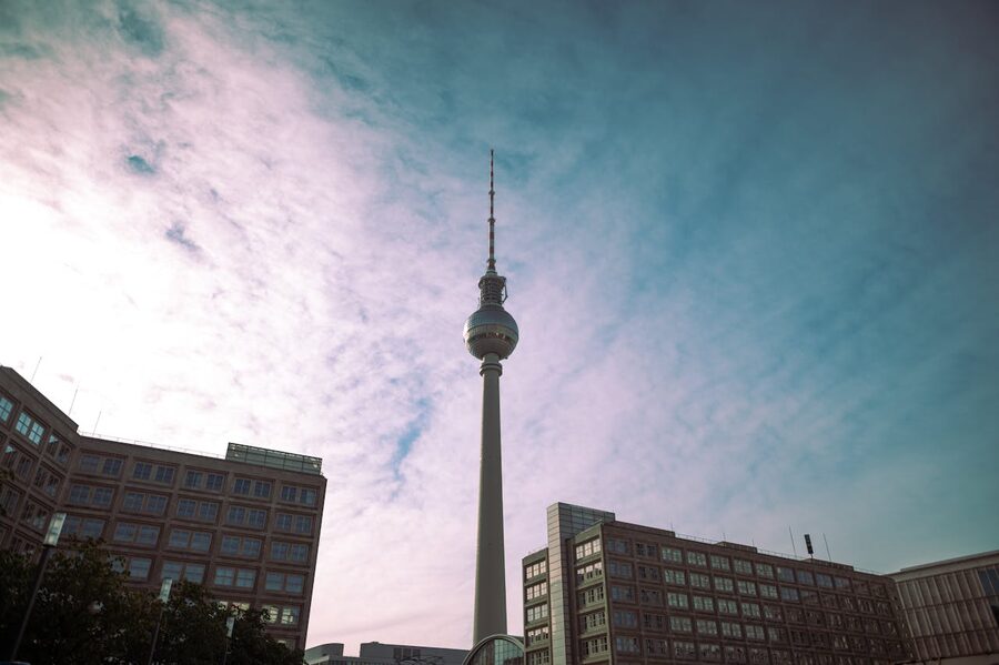 Berlin TV Tower from below against blue sky