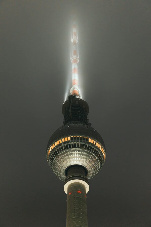 Berlin TV Tower in fog at night