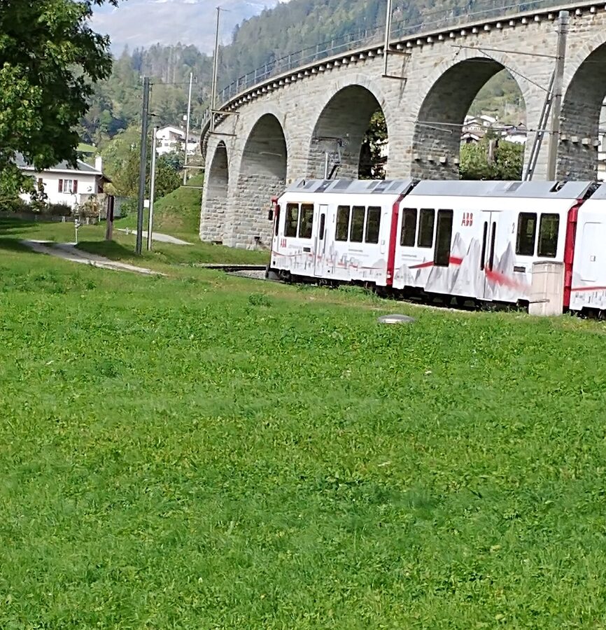 Bernina Express red train in Alps