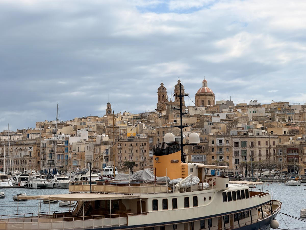 Vittoriosa harbour with historic buildings and boats in Malta