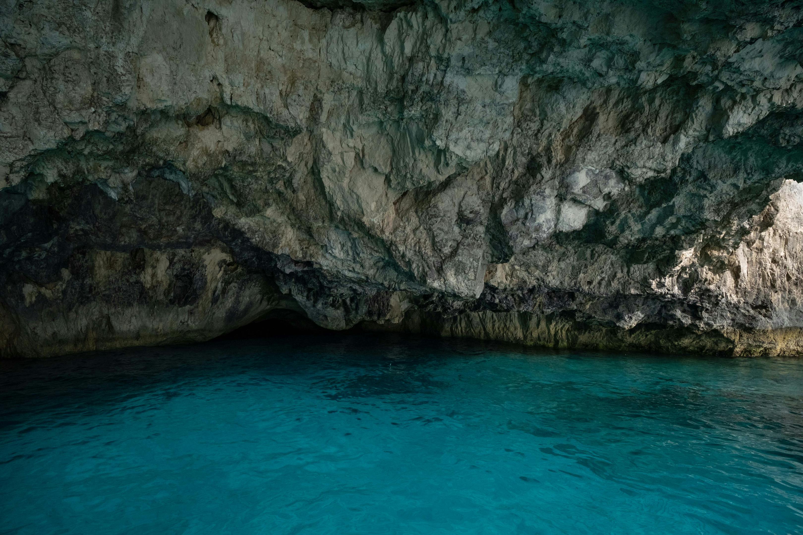 Explore the tranquil blue waters inside a breathtaking natural sea cave