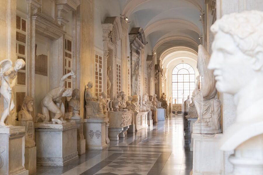 Museum hallway lined with classical sculptures