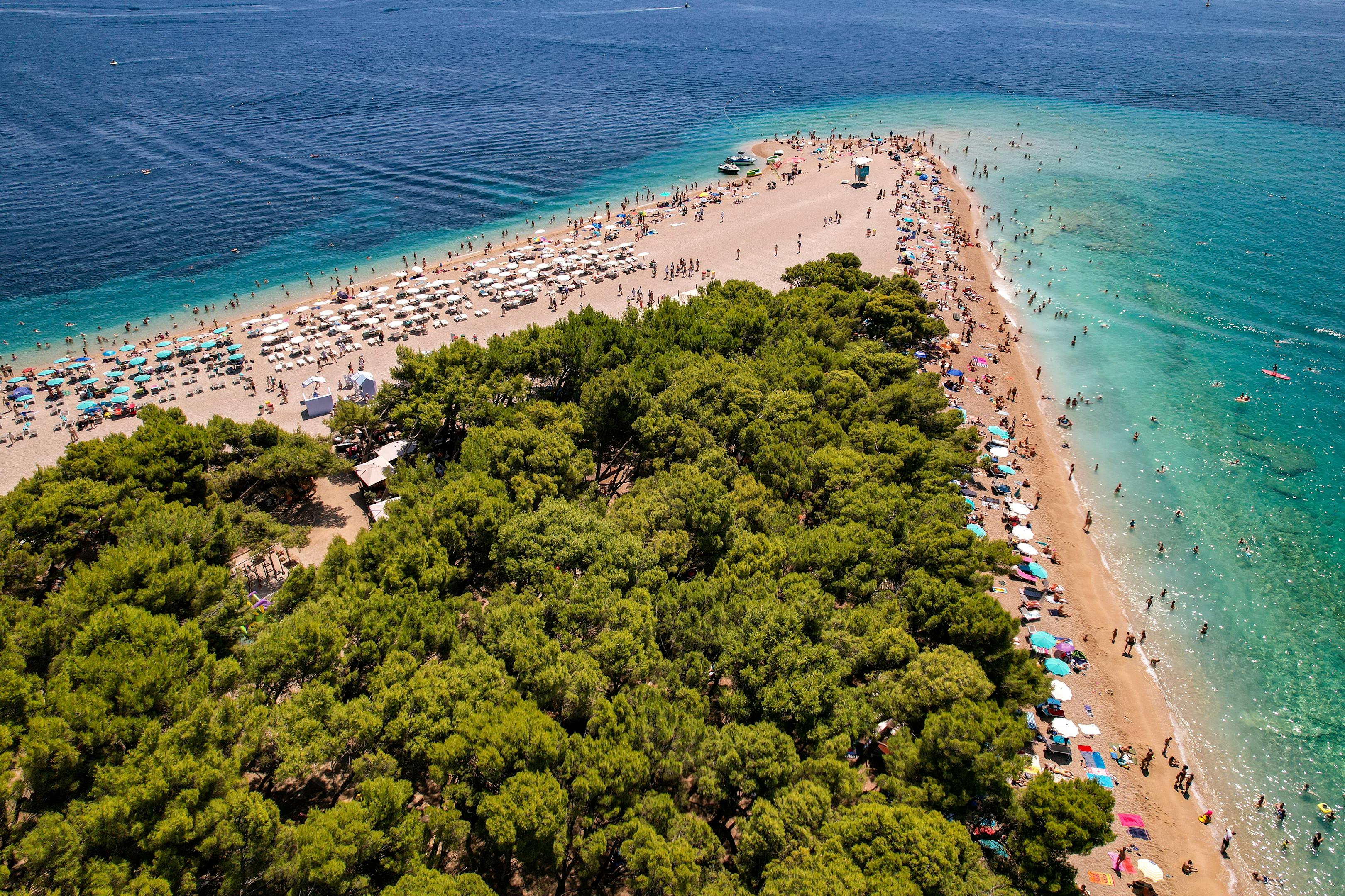 Stunning aerial view of the famous Zlatni Rat Beach with turquoise waters, ideal for summer vacations