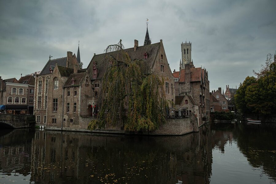Medieval architecture reflected in the serene waters of Bruges canal