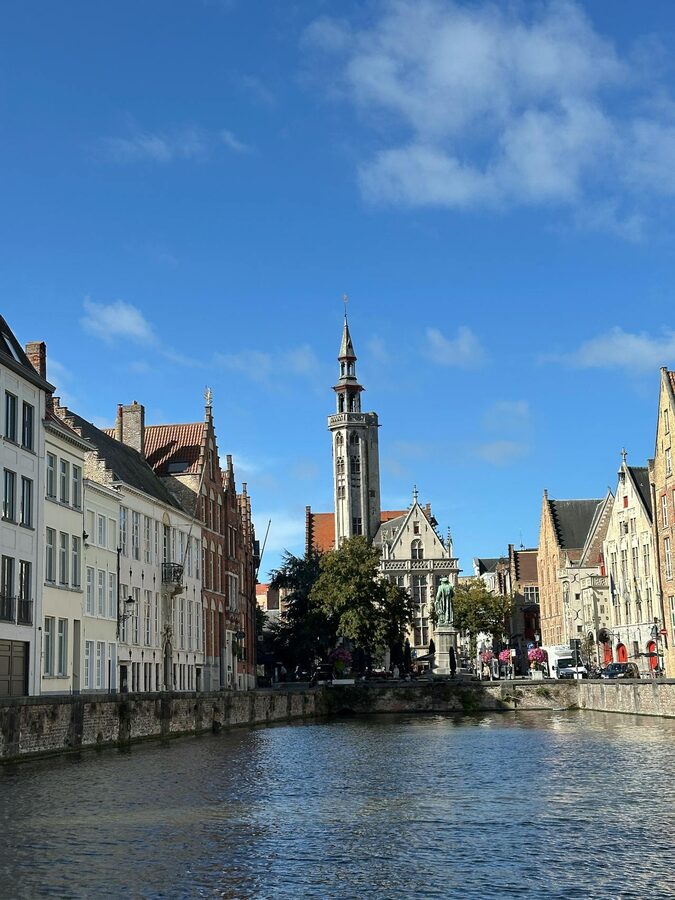 Picturesque canal scene in Bruges showcasing medieval architecture
