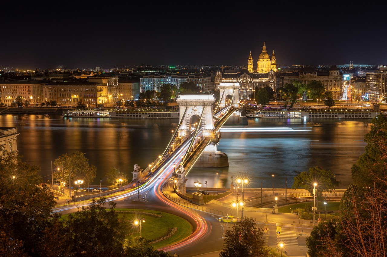 Budapest Parliament building illuminated at night along the Danube