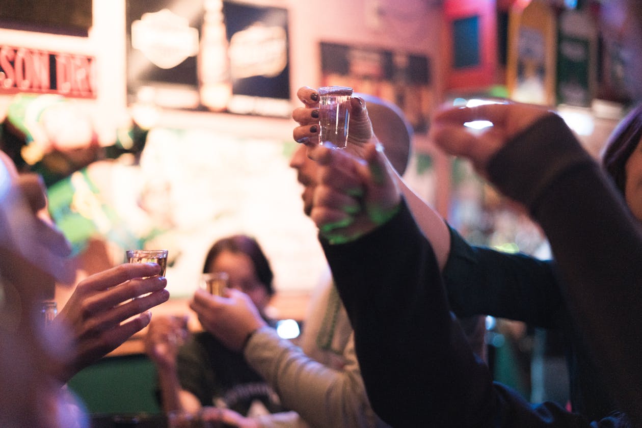 Group of friends enjoying a night out at a bar