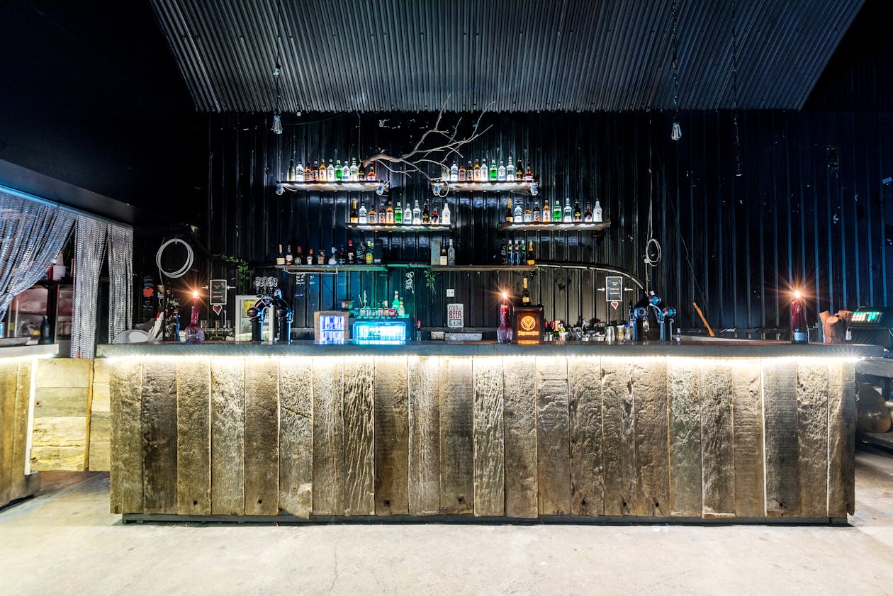 Rustic wooden bar counter with ambient lighting