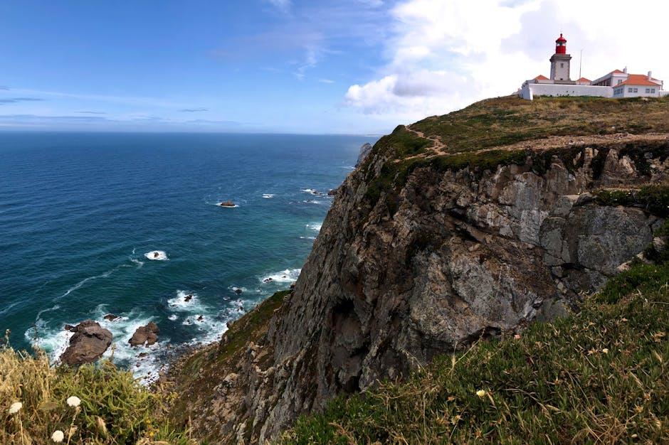 Dramatic cliff formations at Cabo da Roca with crashing waves below