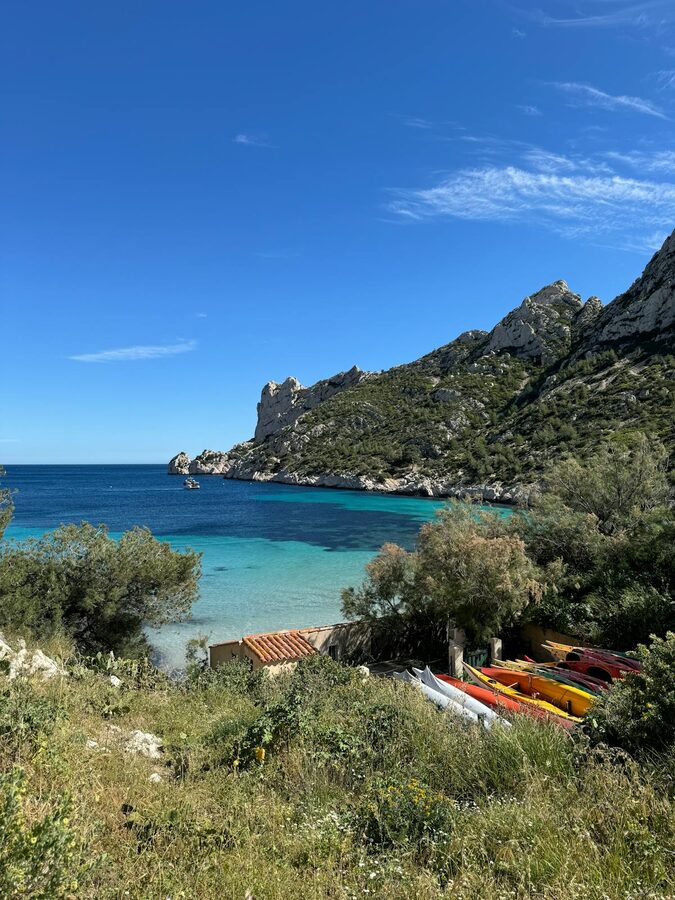 Kayaking in turquoise cove in the Calanques