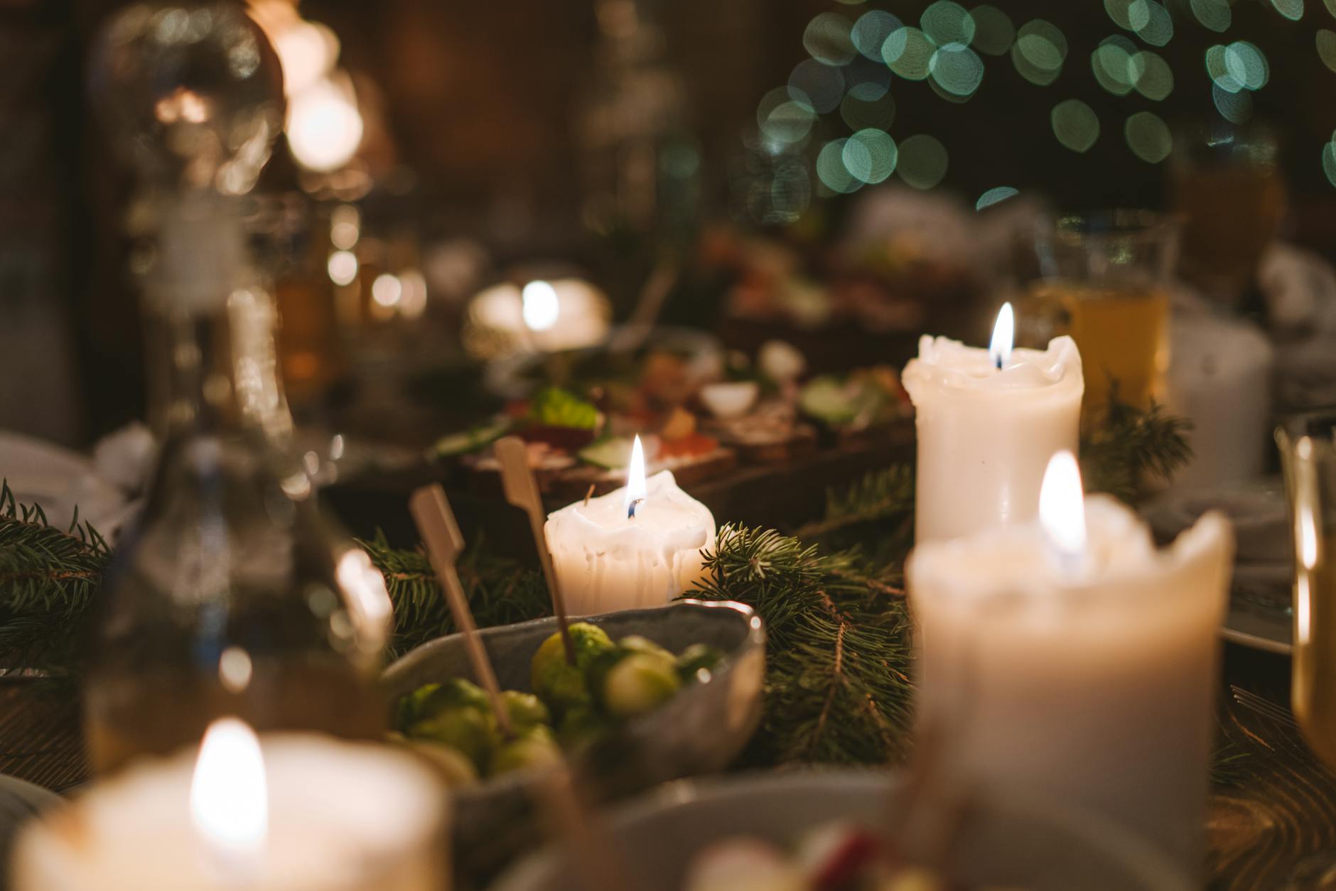 A candlelit dining table with warm ambiance and festive table setting