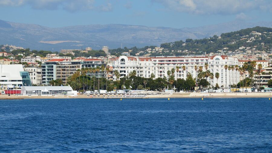 Cannes coastline with buildings and clear blue Mediterranean sea