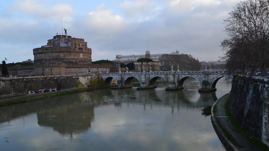 Castel Sant Angelo with bridge reflected in river