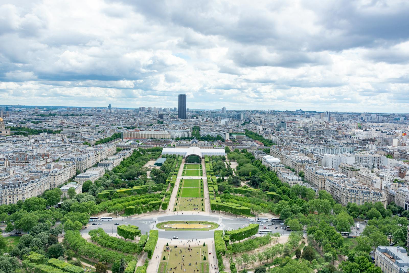 Aerial panoramic view of the Champ de Mars with the Eiffel Tower and Paris in the distance