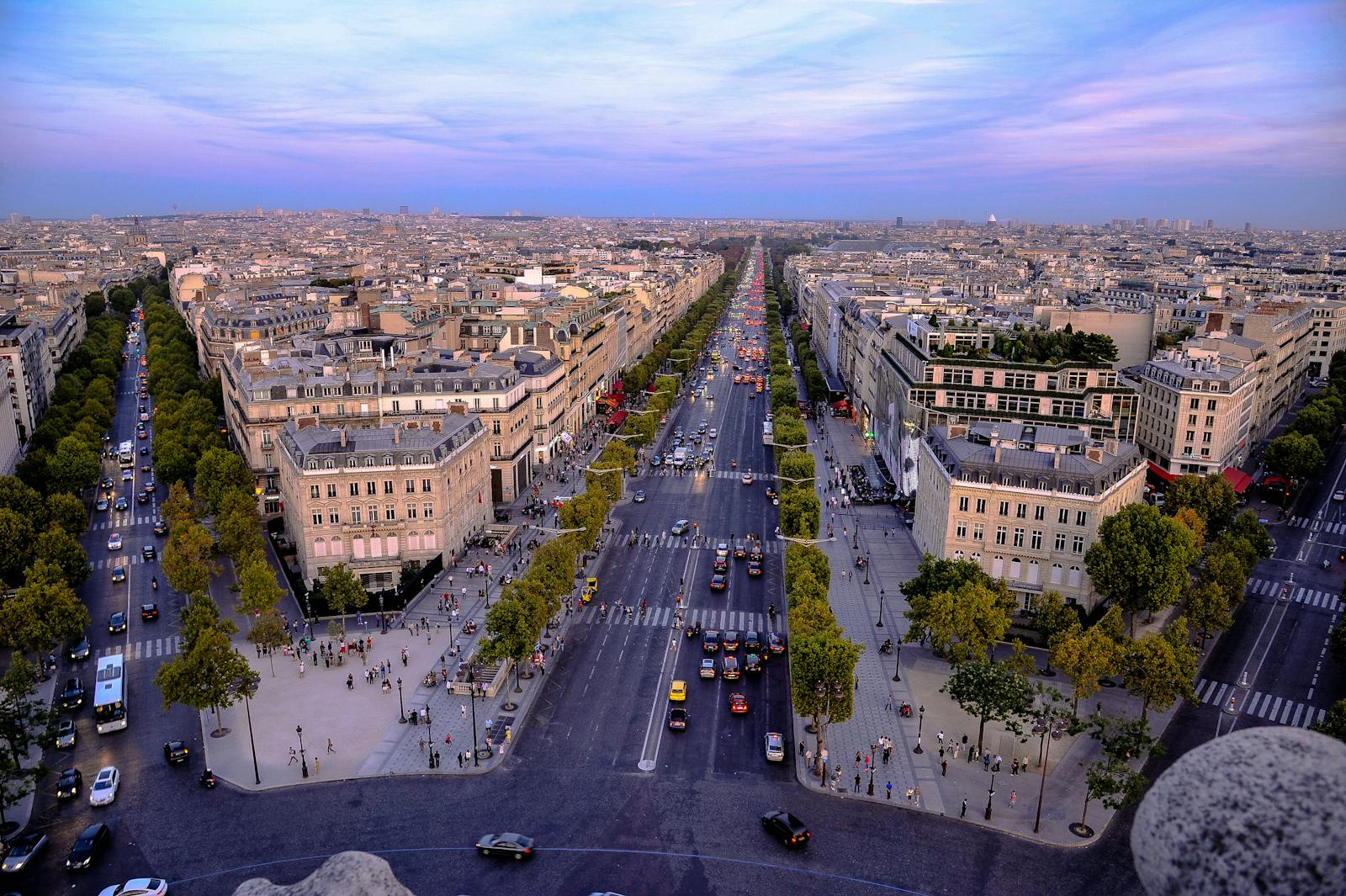 Stunning aerial photo of Paris showcasing the historic Champs-Élysées at dusk