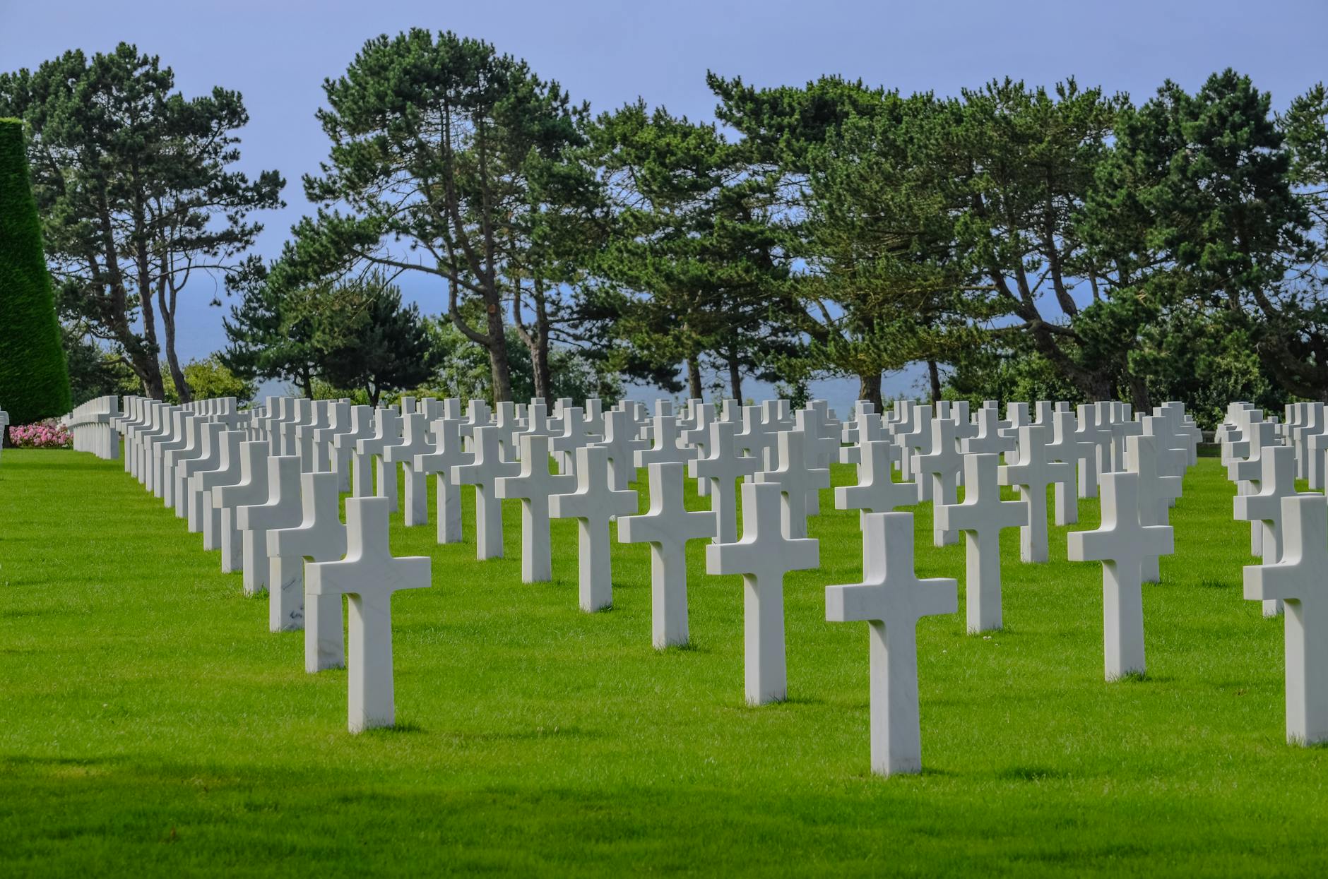 White marble crosses at the Normandy American Cemetery in Colleville-sur-Mer with manicured lawns