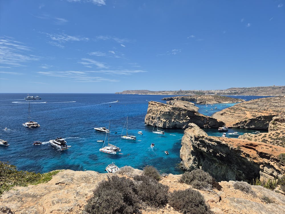 Comino Island Blue Lagoon with boats and clear blue water
