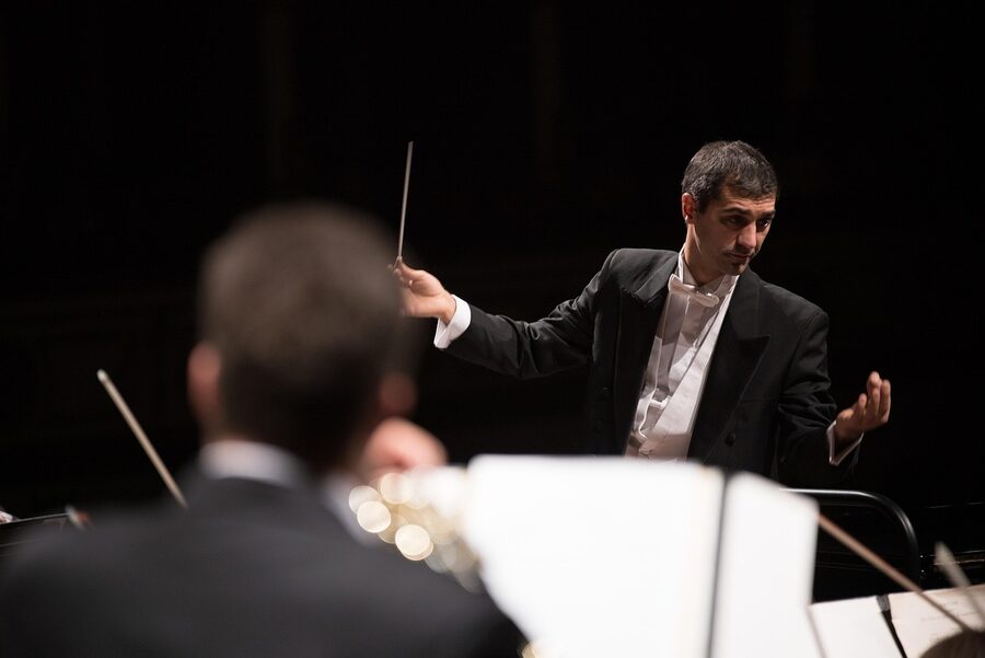 Conductor leading orchestra symphony