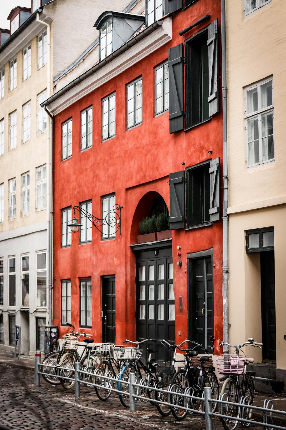 Charming Copenhagen street with bicycles against colourful buildings