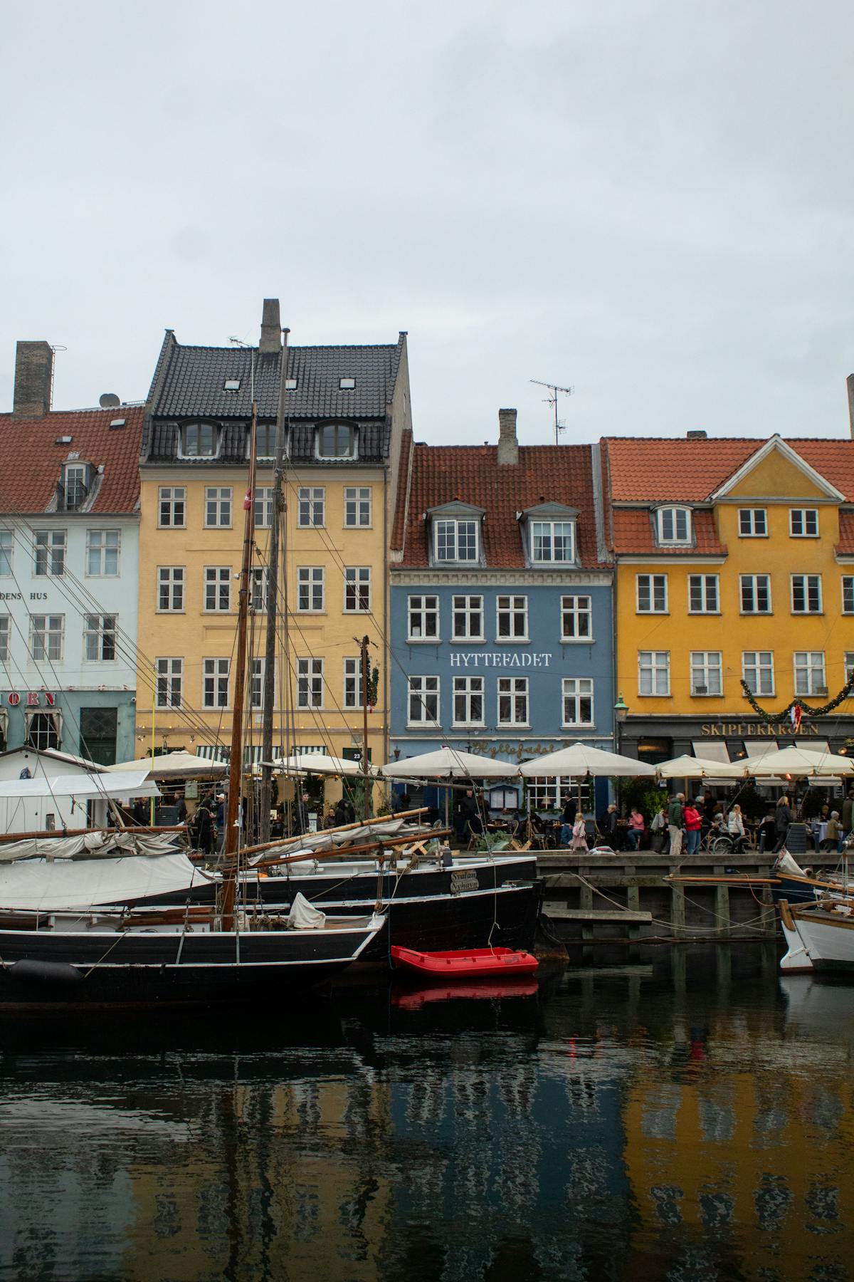 Colourful Nyhavn waterfront with boats and vibrant Danish architecture in Copenhagen