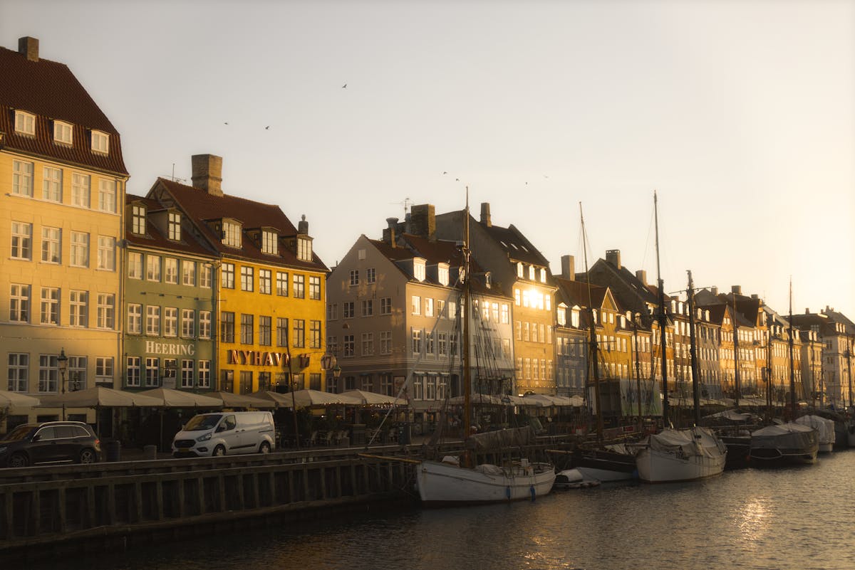 Peaceful morning view of Nyhavn canal with colourful buildings and boats