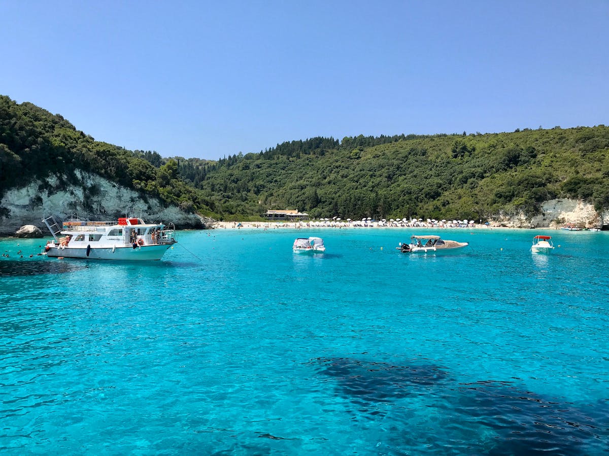 Turquoise waters with boats near Antipaxos island