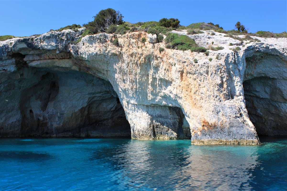 Blue caves with turquoise water and rock formations
