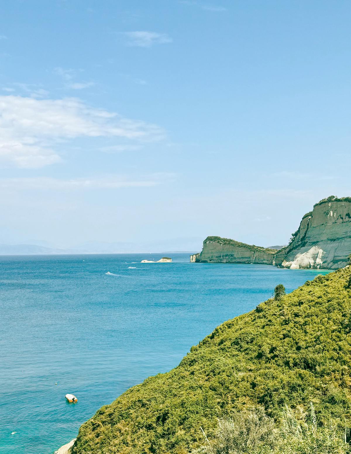 Corfu coastline with turquoise waters and lush greenery