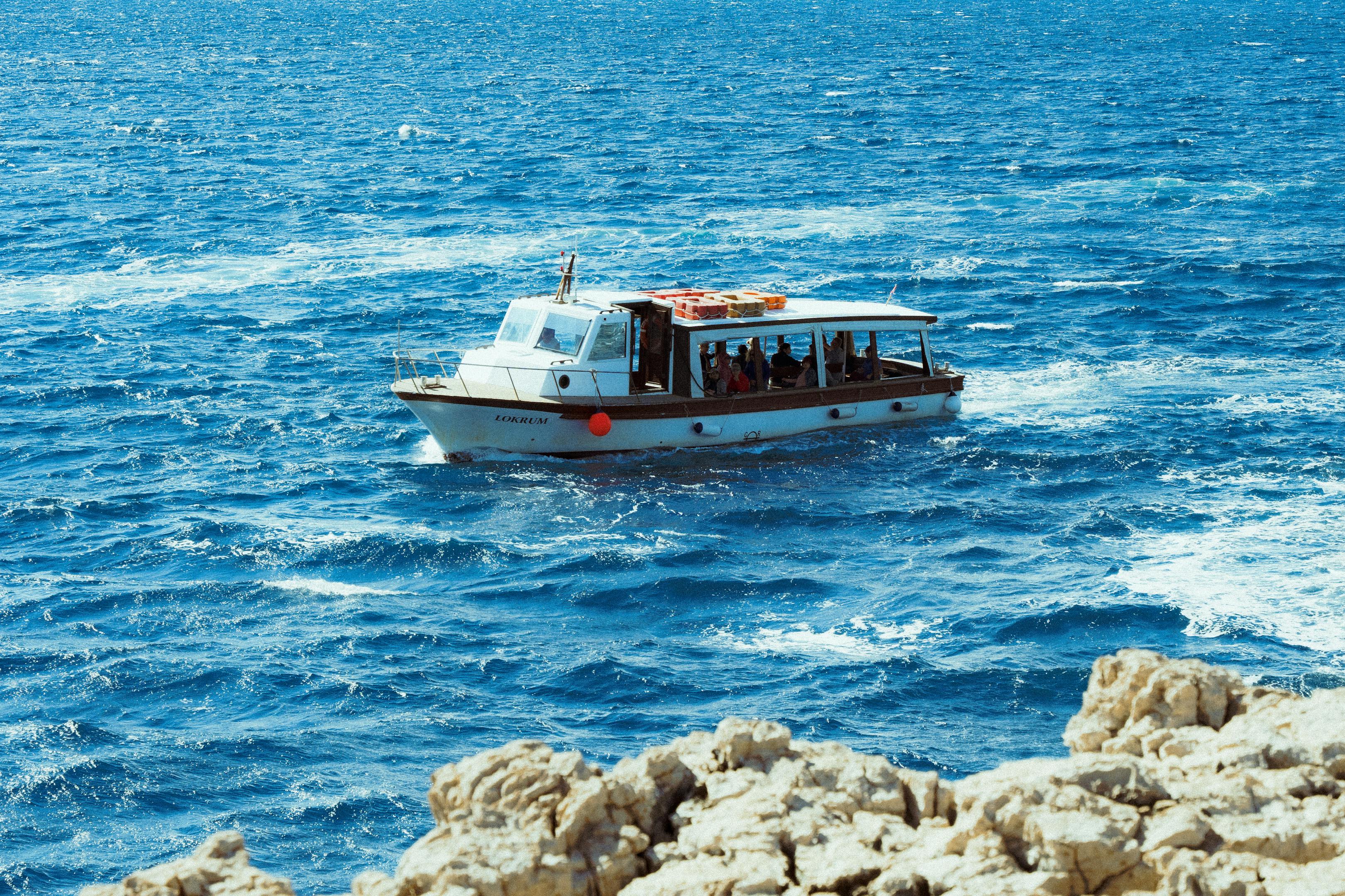 A serene boat ride on the vibrant blue waters of the Adriatic Sea in Croatia